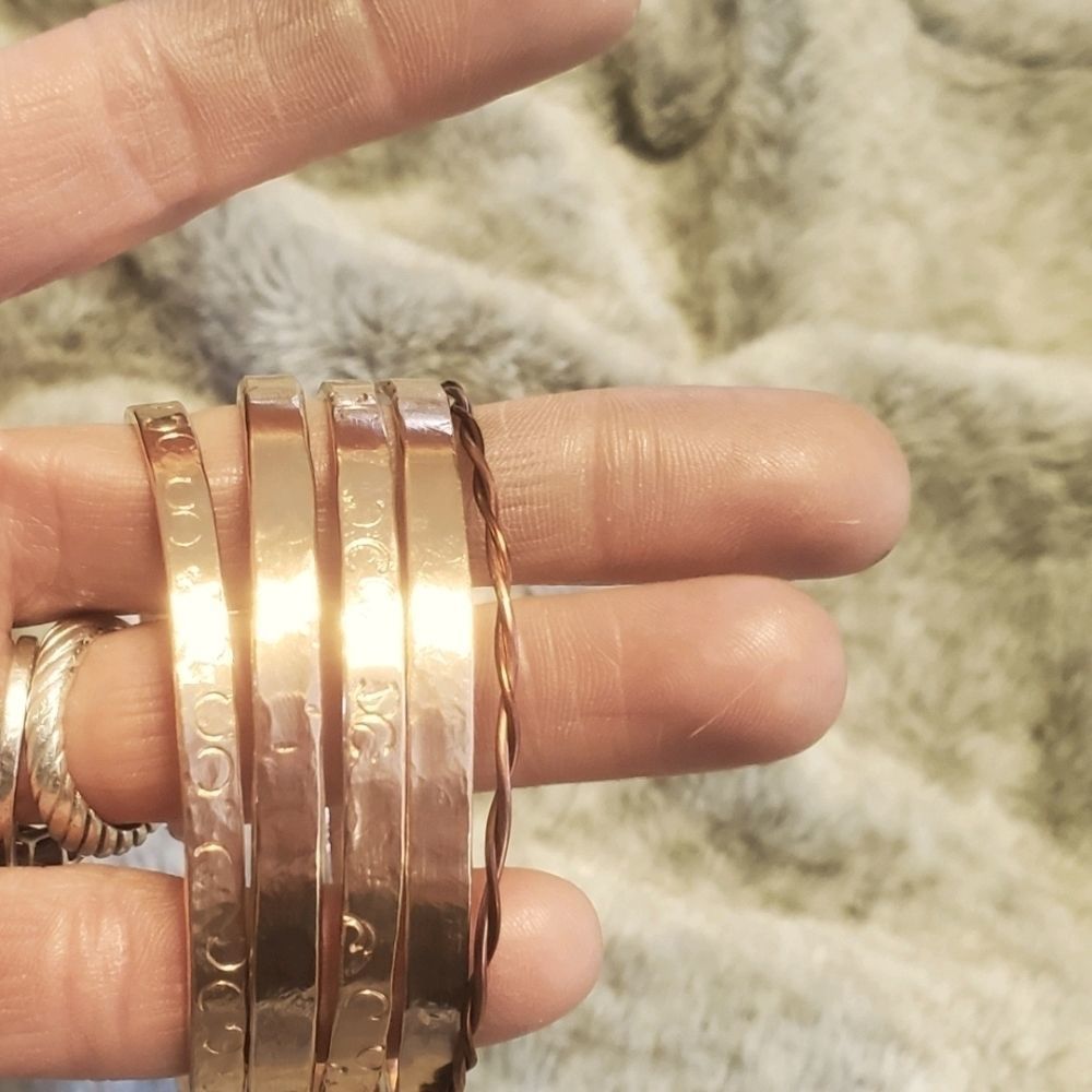 Hand forged set of copper stacking cuffs